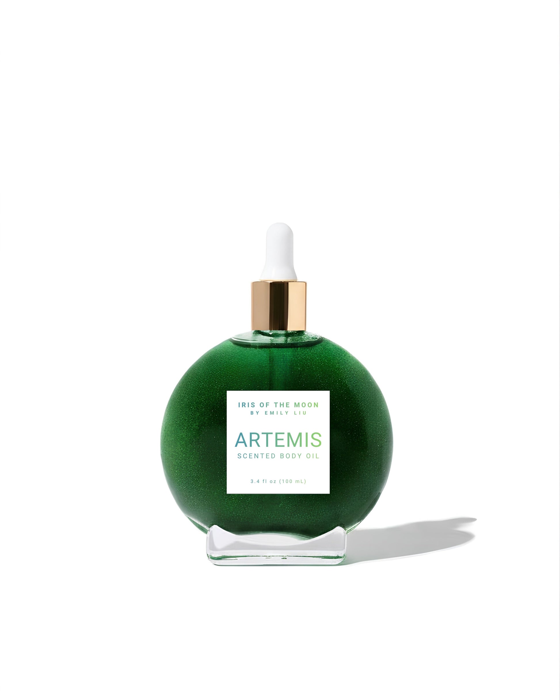 A green spherical bottle of Artemis scented body oil with a white dropper cap and a gold collar, displayed on a clean white background with a soft shadow.