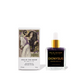 Dionysus Scented Body Oil by Iris of the Moon, showing the clear glass bottle with a gold cap and dark liquid alongside its illustrated white packaging box.