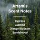 Artemis scent notes list: Cypress, Jasmine, Orange Blossom, Sandalwood over a misty pine forest background.
