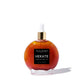 Red bottle of Hekate body oil with a dropper on a white background