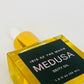 Bottle of 'Iris of the Moon Medusa Deity Oil' on a white background