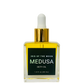 Bottle of Iris of the Moon Medusa Deity Oil with dropper on a white background