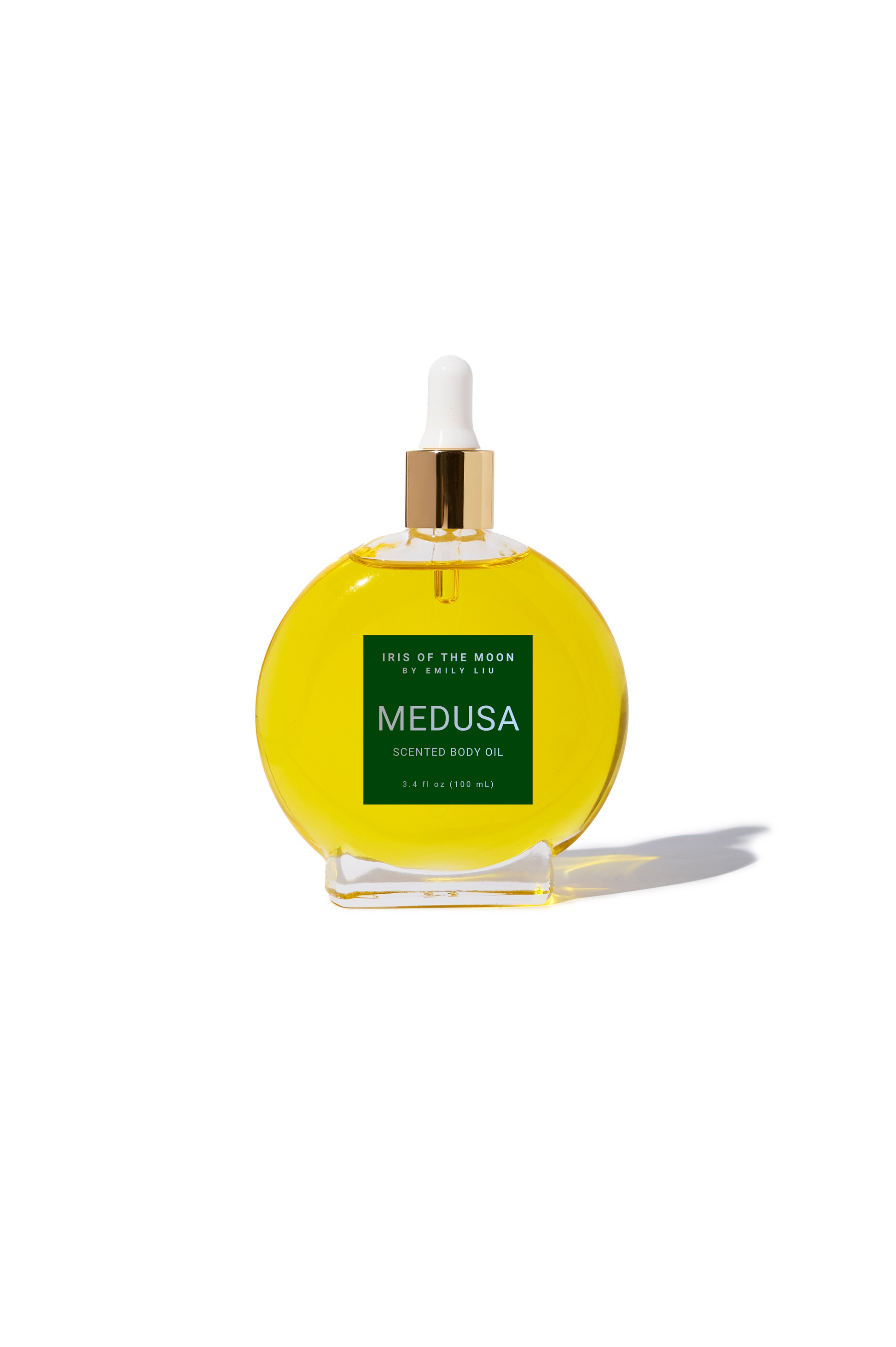 Medusa large circular perfume bottle on a white background